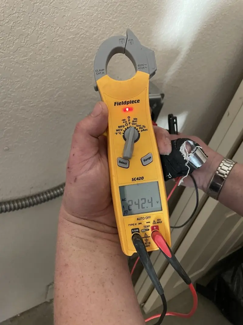 Voltage testing with clamp meter during Recessed Lighting Installation in Princess Anne